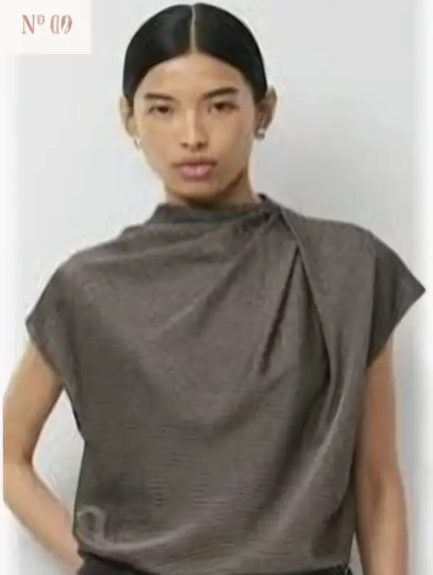 Refined high-neck top styling reference