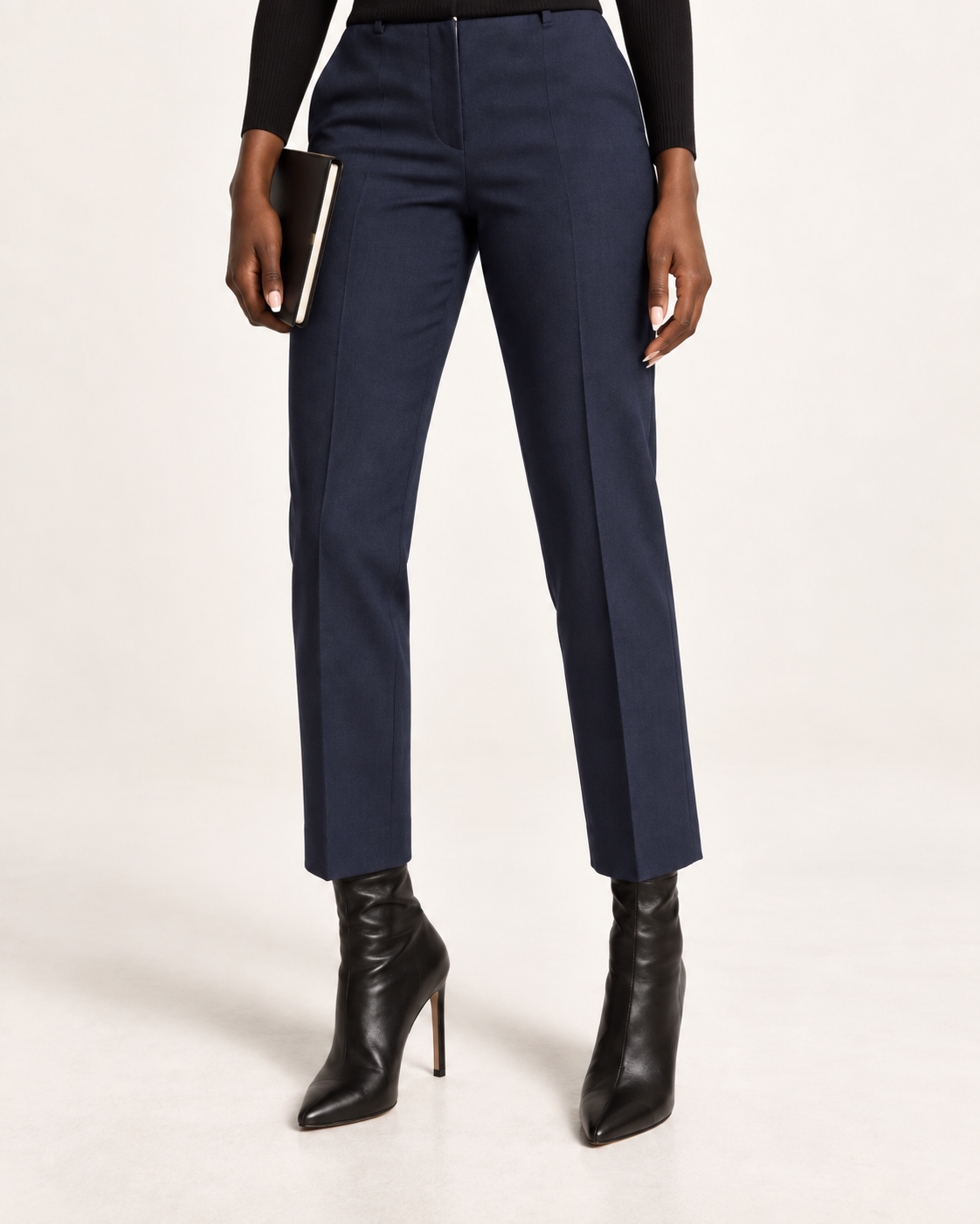 Navy cropped dress pants with tall fitted black sock boots